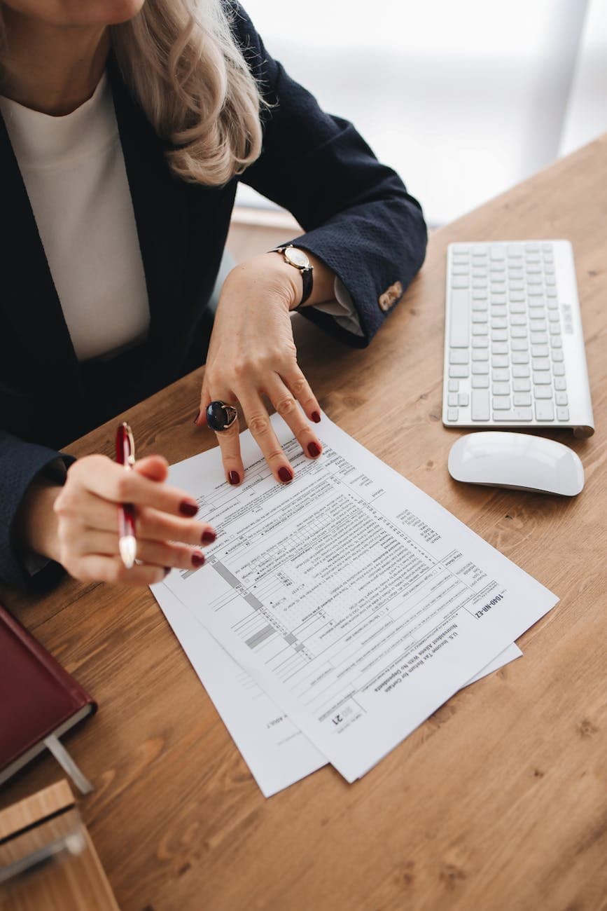 professional accountant reviewing tax documents for international workers (Pexels)